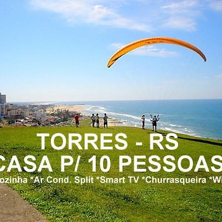 Casa De 2 Quartos Com 2 Ares-Condicionados Em Torres-Rs - Na Mais Bela Praia Gaucha - Cozinha - Banheiro - Tv Smart 32 E Wi-Fi - Estacionamento - Anfitria Superhost No Bnb Villa Buitenkant foto