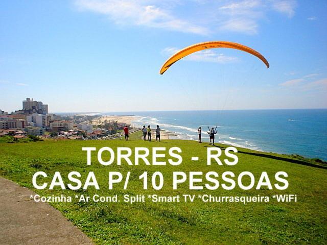 Casa De 2 Quartos Com 2 Ares-Condicionados Em Torres-Rs - Na Mais Bela Praia Gaucha - Cozinha - Banheiro - Tv Smart 32 E Wi-Fi - Estacionamento - Anfitria Superhost No Bnb Villa Buitenkant foto